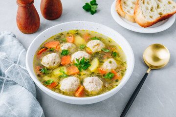 Meatballs soup. Chicken vegetables meatballs soup with carrots and potatoes.