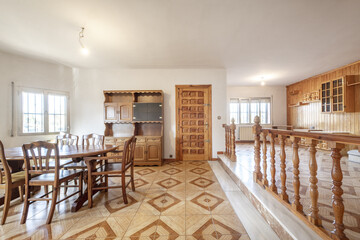 Living room with double-height stoneware floors, a wooden railing, dining table with matching...