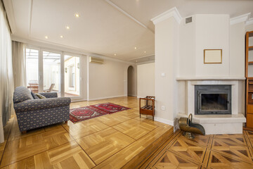 Long living room with two heights, wonderful wooden floors with inlaid wood, several upholstered...