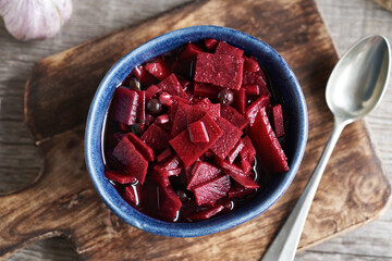 Beetroot kvass - fermented red beets in a bowl, top view