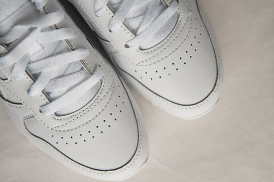 white sneakers on a white background
