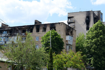 Fototapeta na wymiar Russian armed forces damaged by a shell dwelling house in Bucha town, Ukraine