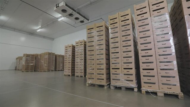 Boxes in stock. A box of food in a warehouse. Modern warehouse with food products. Boxes in a modern warehouse.