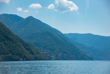 Fototapeta na wymiar Lake Como in Italy. Natural landscape with mountains and blue lake