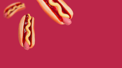 Hot dog isolated on a viva magenta background.