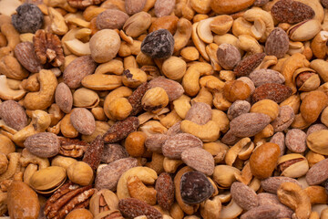 A group of almonds, pistachios, walnuts, macadamia, cashews.