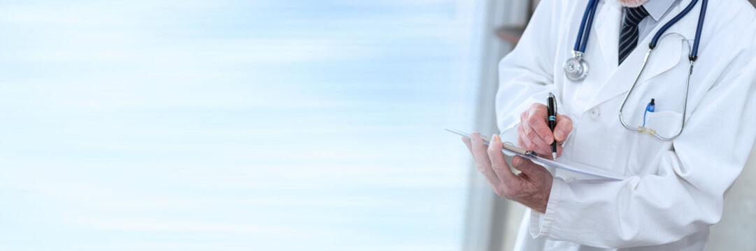 Doctor taking notes on clipboard; panoramic banner