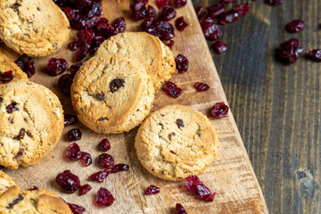 delicious dried cookies made of high-quality flour with dried red cranberries on the table