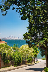 View from the street with beautiful blooming gardens and trees to the Marmara Sea on the Adalar Islands. Istanbul