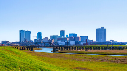 Fototapeta na wymiar Fort Worth panoramic city skyline and buildings over Trinity River in Texas, USA, modern cityscape with natural open space and trails