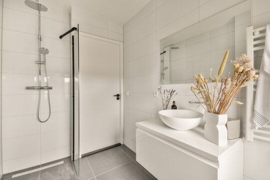 Interior of modern bathroom with shower cabin