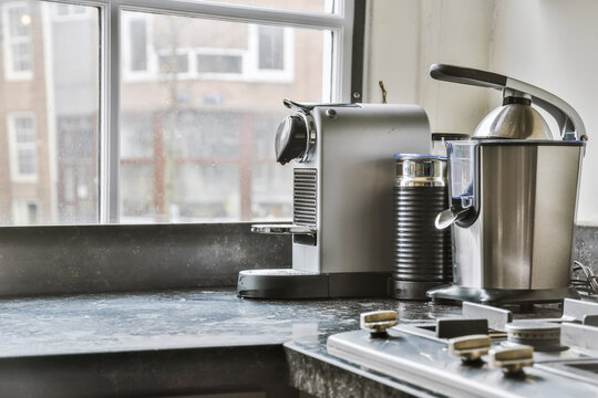 Coffee machine in modern kitchen at home