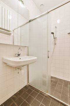 Interior of modern bathroom with shower cabin