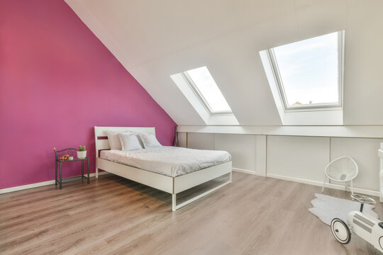 Modern bedroom interior with mansard windows