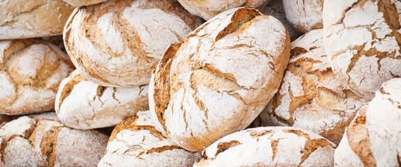 Fresh loaves of rye or wheat bread