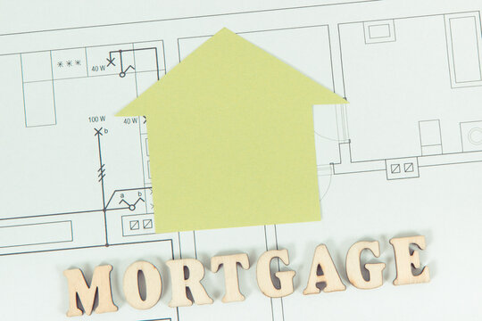 Inscription mortgage and home shape on construction diagrams of house
