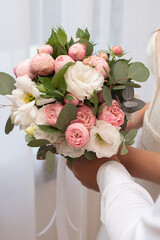 delicate wedding bouquet in the hands of the bride. idea for event agencies