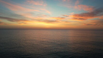 Picturesque sunrise over calm smooth waters of Mediterranean Sea. Sunny morning glow. Travel and tourism concept