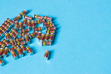 SMD diodes, on a table with a blue background, electronic components