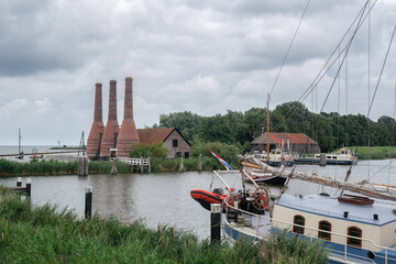 This image shows three chimneys of former lime kilns located on the grounds of the Zuiderzee Museum in Enkhuizen.