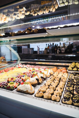 Italian Bakery counter, Window of desserts at a pastry shop. Fresh and tasty products