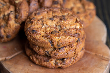 Delicious cookies with pieces of chocolate on the table