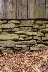 Stacked stones at the bottom of a country house.