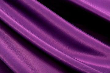 Texture of a smooth luxurious, elegant fabric in burgundy, purple, red. Purple satin or silk fabric with folds and waves