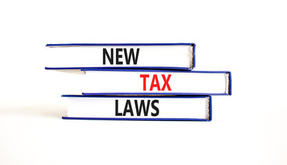 New tax laws symbol. Concept words New tax laws on books on a beautiful white table white background. Business new tax laws concept. Copy space.