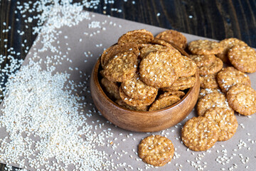 oatmeal thin round cookies with lots of sesame seeds
