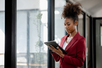 American woman in the office of a startup company, she is a company employee, young generation operations run the company with the concept of the new generation. Company management concept