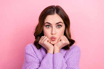 Photo of gorgeous cute lady wear stylish warm comfort clothes arm under chin send you sweet kiss...