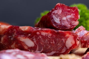 sliced sausage from pieces of meat with bacon