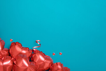 Valentines Day greeting card background. Red heart shape balloons on turquoise backdrop