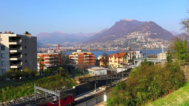 Freight train passing by Lugano-Paradiso railway station, Switzerland