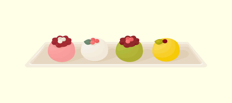 Set of asian desserts on plate - various wagashi, mochi, rice cake