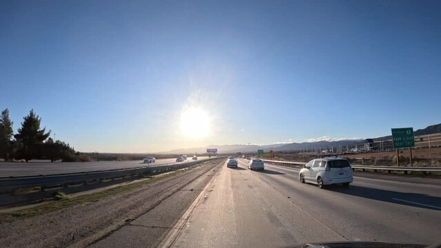 Timelapse of driving through canyon highway in traffic