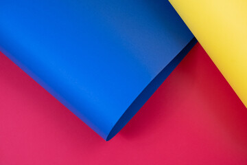 Yellow, blue and red colored cardboards background. Copy space 