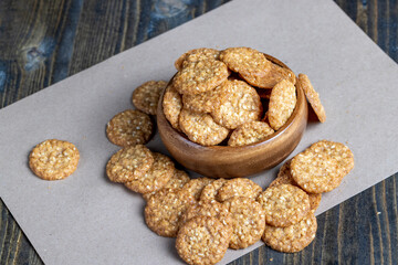 oatmeal thin round cookies with lots of sesame seeds
