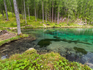 The emerald water of lake Ghedina in the italian Dolomites