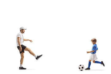 Fototapeta na wymiar Coach playing football with a boy