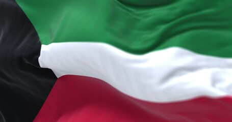 Close-up view of the Kuwait national flag waving in the wind