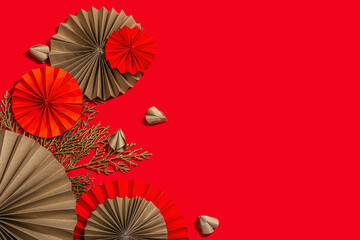 Happy Chinese New Year traditional concept. Oriental asian style paper fans on red background