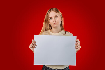 Young american woman holding blank empty paper pointing finger to one self smiling happy and proud isolated on red studio background with clipping path