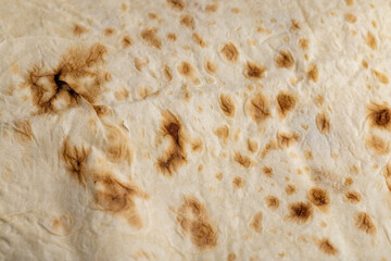 Wheat pita bread with dark spots