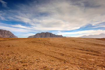 Fototapeta na wymiar Afghanistan landscape, desert plain against the backdrop of mountains
