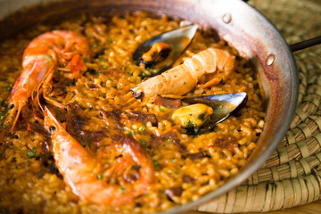 Traditional Spanish paella with red prawns from Ibiza. Typical recipe with seafood from the famous Spanish tapa.