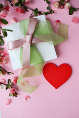 gift concept for valentine's day. red gift box and red heart isolated on white background