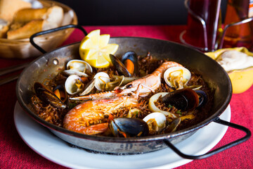 Fideua with squid and seafood. Typical Spanish tapa cooked with paella.
