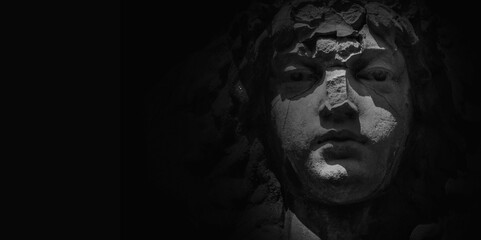 Face of Olympic goddess of love in antique mythology Aphrodite (Venus) Fragment of ancient statue. Copy space. © zwiebackesser